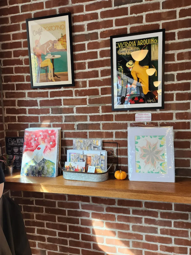 Vintage Italian coffee posters on brick wall